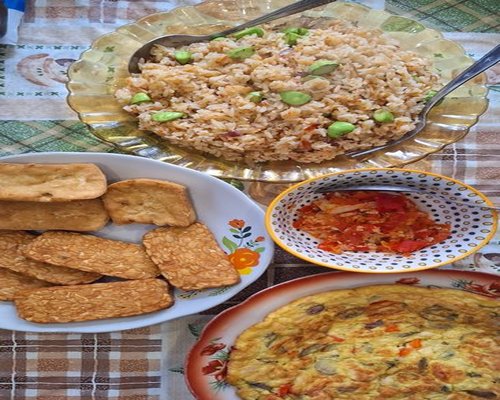Traditional Indonesian healthy home cooked meal with tempeh and vegetables